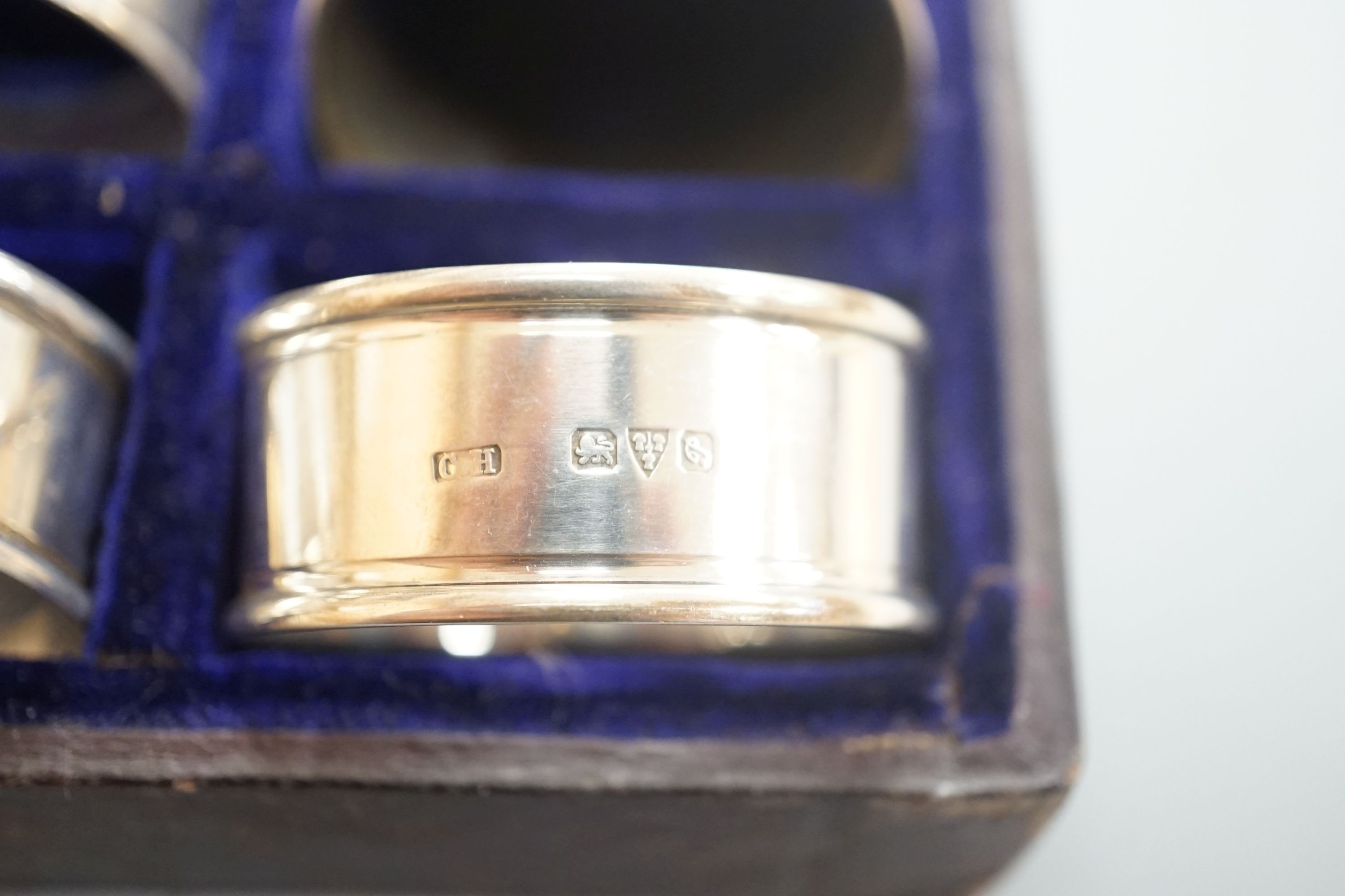 A cased matched set of twelve silver napkin rings by Charles Horner, Chester, various dates.
